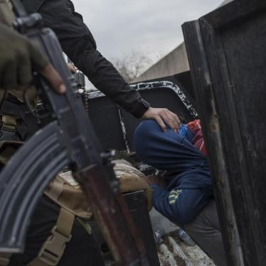 Members of the Iraqi National Security Service arrest a young man they suspect of being affiliated with ISIS in eastern Mosul on March 15, 2017. © 2017 Sam Tarling 