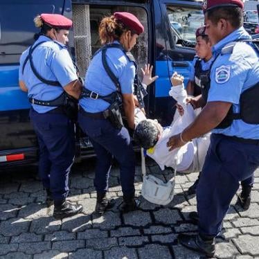 A person is arrested by riot police during a protest against the government of President Daniel Ortega in Managua