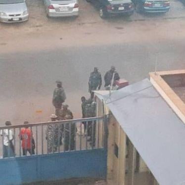 Nigerian Army officials lay siege at the gate of Daily Trust office in Abuja on January 6, 2019. © Daily Trust