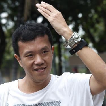 In this January 11, 2018, photo, activist Ekachai Hongkangwan show his watches during a demonstration highlighting the corruption allegations against Deputy Prime Minister Prawit Wongsuwan in front of Government House. 