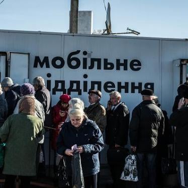 Older people lining up at bank machines in government-controlled areas of Ukraine.