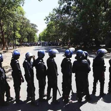 Armed riot police block the road as doctors attempt to march in Harare, Zimbabwe