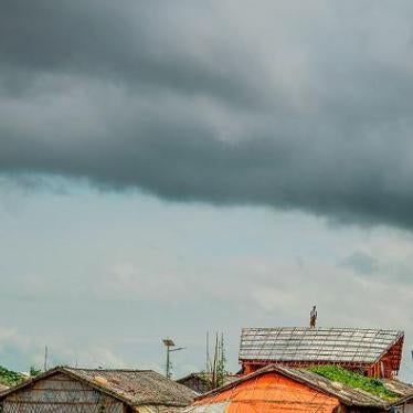 A Rohingya refugee man stands on a makeshift house at the Kutupalong refugee camp in Ukhia on Setember 13, 2019. (Photo by MUNIR UZ ZAMAN / AFP) (Photo credit should read MUNIR UZ ZAMAN/AFP/Getty Images)
