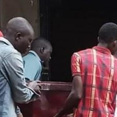 Relatives of Brian Wasswa carry his coffin during his funeral on October 6, 2019. 