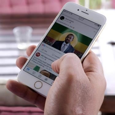 A man scrolls down his cell phone for social media newsfeed in Addis Ababa, Ethiopia October 11, 2019.