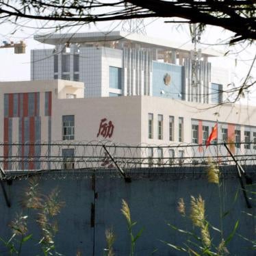 Barbed wire surrounds the walls around a cluster of schools on the outskirts of Kashgar, in western China's Xinjiang region, August 31, 2018. 