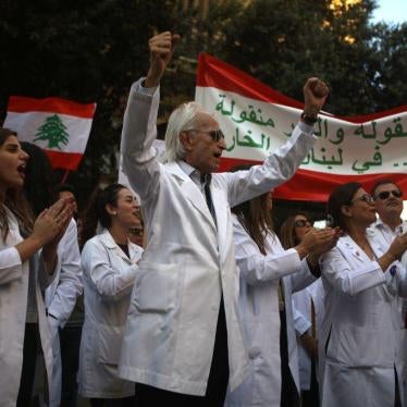 Lebanese doctors chant slogans as they take part in anti-government demonstrations in central Beirut on November 12, 2019. 