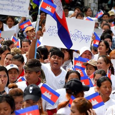 Workers march along a street to mark International Labour Day in Phnom Penh on May 1, 2019.
