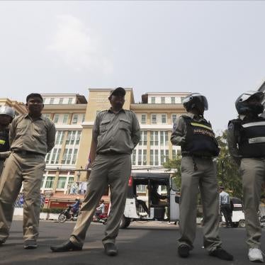 Cambodian police officers stand guard in front of the Phnom Penh Municipal Court during a hearing of Kem Sokha, the head of the dissolved Cambodia National Rescue Party, in Phnom Penh, Cambodia, Thursday, Jan. 16, 2020. The trial of the top Cambodian oppo